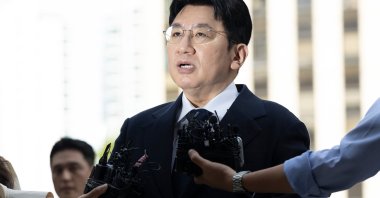 Bang Si-Hyuk, chairperson of Hybe, answers reporters' questions upon his arrival at the Seoul Metropolitan Police Agency, Seoul, South Korea, Sept. 15, 2025. (AP Photo)