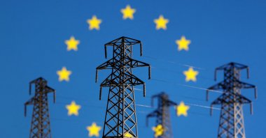 Electric power transmission miniatures are seen in front of the displayed EU flag in this illustration taken on Dec. 5, 2022. (Reuters Photo)