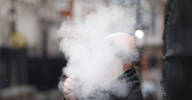 A person vapes inside the precincts of London’s High Court in London, Britain, Oct. 1, 2025. (Reuters File Photo)