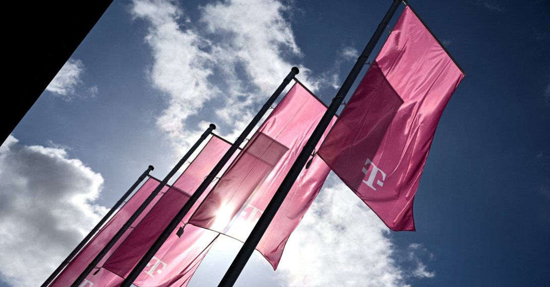 Flags with the logo of Deutsche Telekom AG flutter on the day of the annual shareholder meeting in Bonn, Germany, April 1, 2026. (Reuters Photo)