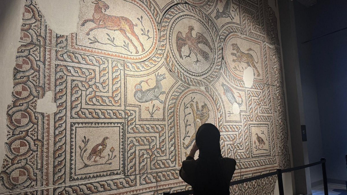 A visitor takes a photo of a mosaic at the Manisa Museum, Manisa, western Türkiye, April 16, 2026. (AA Photo)