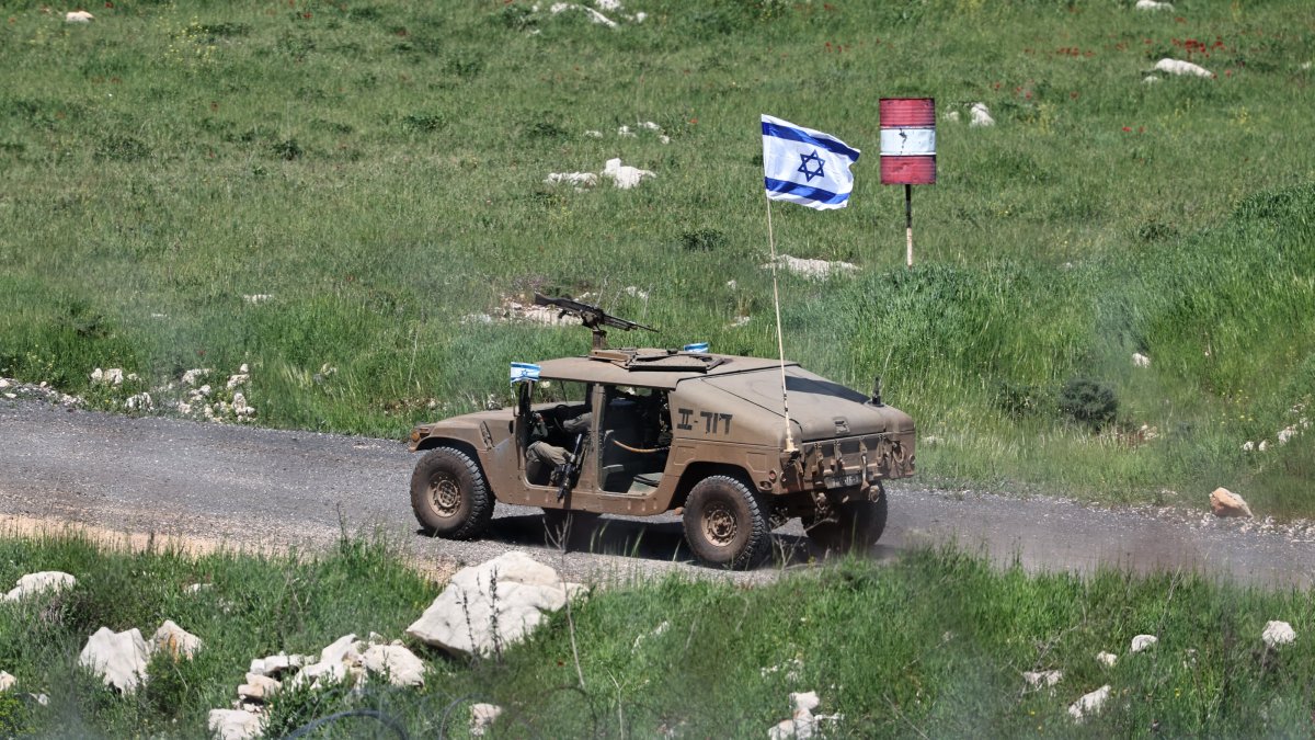 An Israeli military vehicle patrols inside the Syrian buffer zone, as seen from the village of Majdal Shams, in the Israeli-occupied Golan Heights, Syria, April 22, 2026. (EPA Photo)