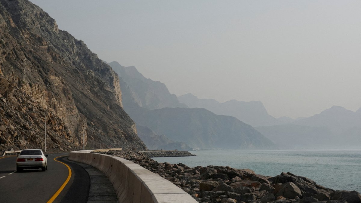 A car rides along the coast of Musandam overlooking the Strait of Hormuz amid the U.S.-Israeli conflict with Iran, Oman, March 2, 2026. (Reuters Photo)