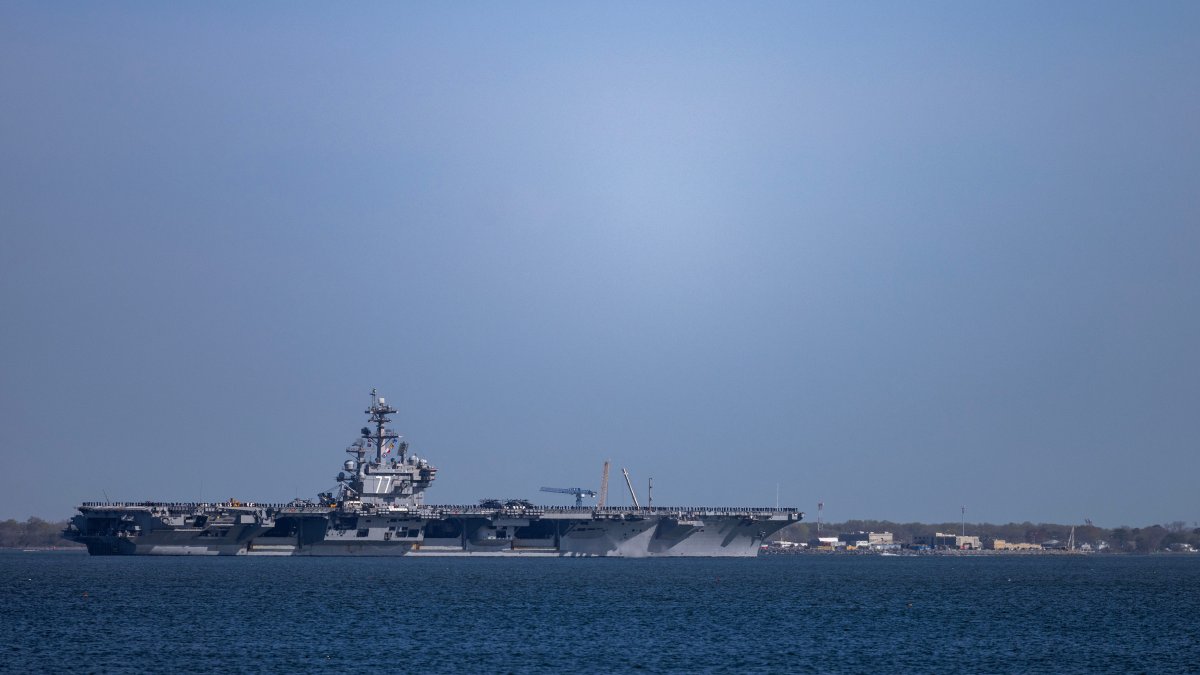The USS George H.W. Bush (CVN 77) travels on the James River toward the Hampton Roads Bridge-Tunnel after departing from Naval Station Norfolk in Norfolk, Virginia, U.S., March 31, 2026. (AP Photo)