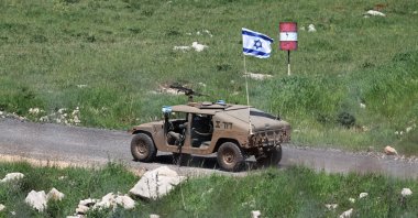 An Israeli military vehicle patrols inside the Syrian buffer zone, as seen from the village of Majdal Shams, in the Israeli-occupied Golan Heights, Syria, April 22, 2026. (EPA Photo)