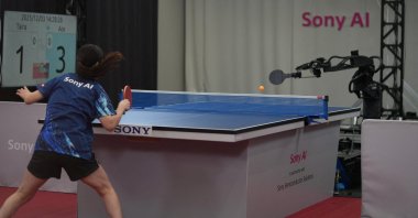 An unidentified female professional table tennis player competes against Sony AI autonomous robot "Ace" in December 2025 in Tokyo, Japan, as seen in this photograph released on April 22, 2026. (Reuters Photo)
