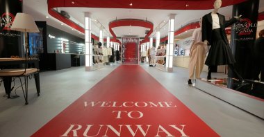 An installation of the new movie 'Devil Wears Prada 2' is displayed at La Rinascente shopping center, Milan, Italy, April 20, 2026. (AP Photo)