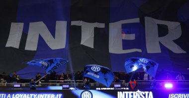 Inter Milan fans support their team with a giant banner inside the stadium before the match, Milan, Italy, April 21, 2026. (Reuters Photo)