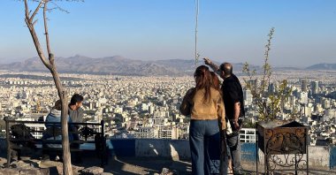 People visit a viewpoint overlooking the city at Pardisan Park, Tehran, Iran, April 22, 2026. (AFP Photo)
