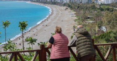 A couple looks down onto Konyaaltı beach, Antalya, southern Türkiye, March 30, 2026. (AFP Photo)