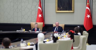 President Recep Tayyip Erdoğan sits next to a boy who was symbolically handed the country's top post on National Sovereignty and Children’s Day, Ankara, Türkiye, April 23, 2026. (AA Photo)