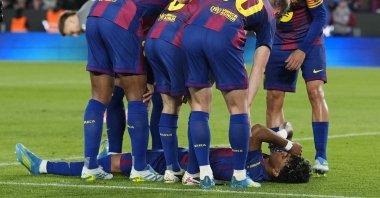 FC Barcelona's Lamine Yamal is surrounded by his teammates after sustaining an injury during the Spanish La Liga match between FC Barcelona and Celta Vigo, Barcelona, Spain, April 22, 2026. (EPA Photo)