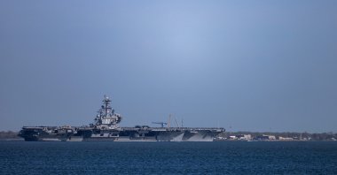 The USS George H.W. Bush (CVN 77) travels on the James River toward the Hampton Roads Bridge-Tunnel after departing from Naval Station Norfolk in Norfolk, Virginia, U.S., March 31, 2026. (AP Photo)