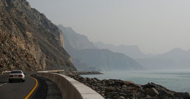 A car rides along the coast of Musandam overlooking the Strait of Hormuz amid the U.S.-Israeli conflict with Iran, Oman, March 2, 2026. (Reuters Photo)