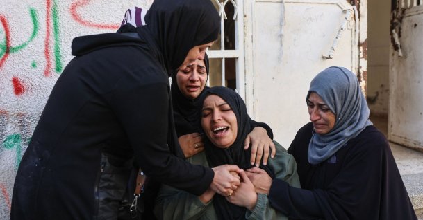 Amnaa al-Abed (C) mourns during the funeral of her sons, Salah and Abdullah, killed in an Israeli airstrike the previous night, at al-Shifa Hospital in Gaza City, Palestine, April 23, 2026. (AFP Photo)