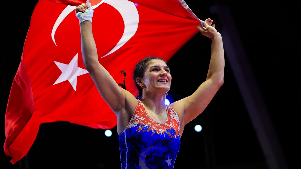 Turkish wrestler Nesrin Baş celebrates with the Turkish flag after winning a gold medal in Tirana, Albania, April 23, 2026. (AA Photo)