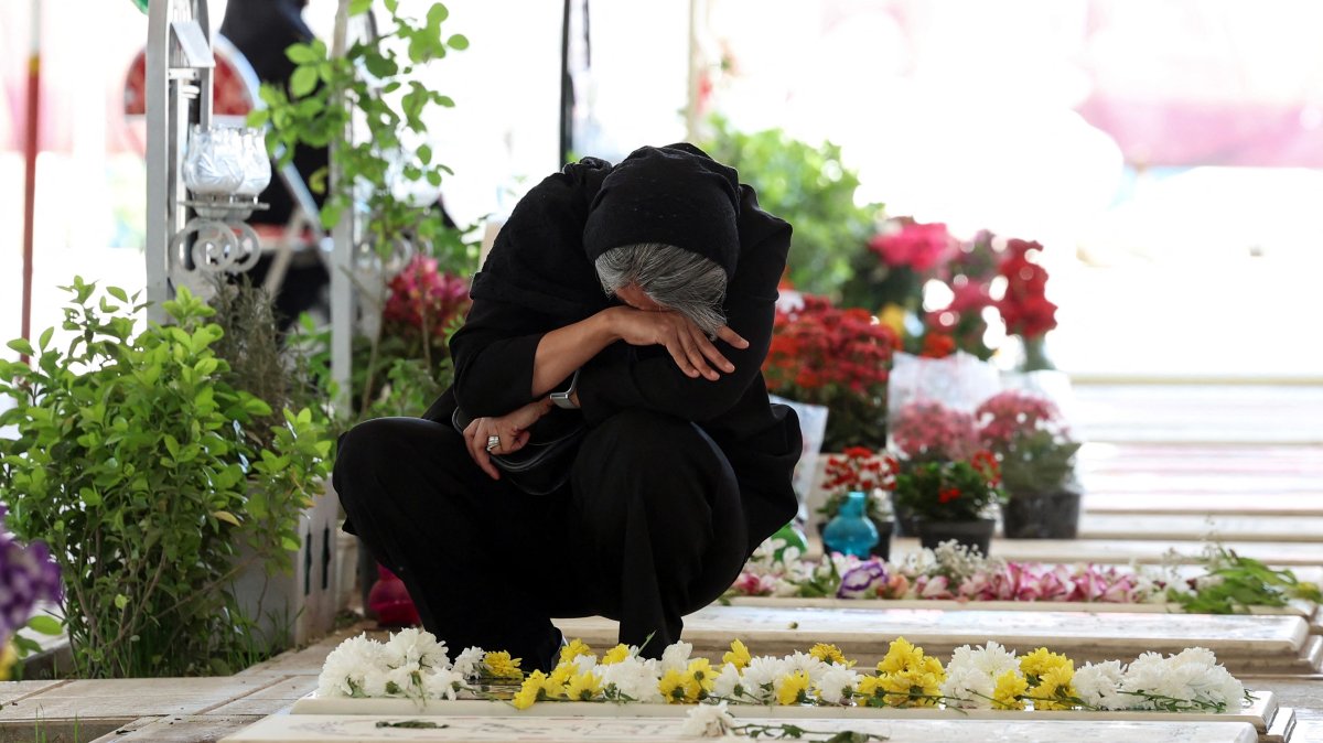 An Iranian woman mourns at the grave of a loved one killed during the U.S.-Israeli attacks at Behesht Zahra Cemetery, Tehran, Iran, April 23, 2026. (AFP Photo)