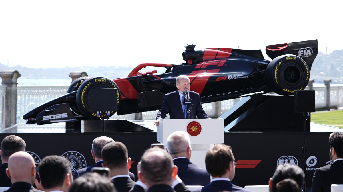 President Recep Tayyip Erdoğan speaks in front of a Formula 1 car as he officially announces the sport’s return to the country, Istanbul, Türkiye, April 24, 2026. (AA Photo)