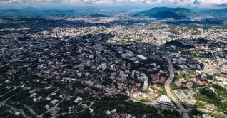 An aerial view of the capital’s urban landscape and surrounding terrain, San Salvador, El Salvador, Aug. 24, 2021. (Shutterstock Photo)