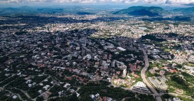 An aerial view of the capital’s urban landscape and surrounding terrain, San Salvador, El Salvador, Aug. 24, 2021. (Shutterstock Photo)
