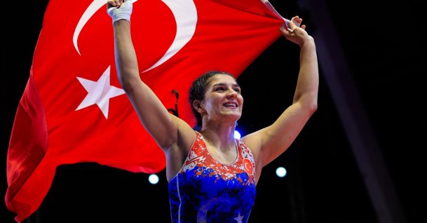 Turkish wrestler Nesrin Baş celebrates with the Turkish flag after winning a gold medal in Tirana, Albania, April 23, 2026. (AA Photo)