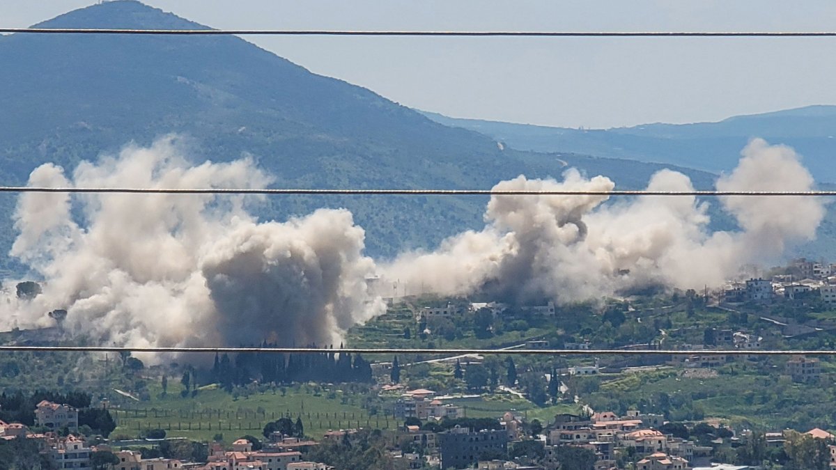Smoke billows from explosions in the southern village of Khiam where the Israeli army has detonated residential homes, Lebanon, April 25, 2026. (AFP Photo)