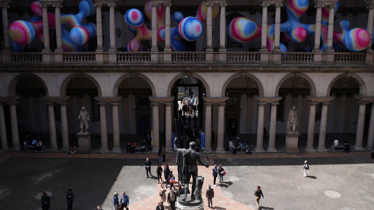 People walk near the “Serotonin – The Chemistry of Happiness” installation by Sara Ricciardi for American Express, at the Pinacoteca di Brera, as part of the Milan Design Week Fuorisalone exhibition, Milan, Italy, April 22, 2026. (Reuters Photo)