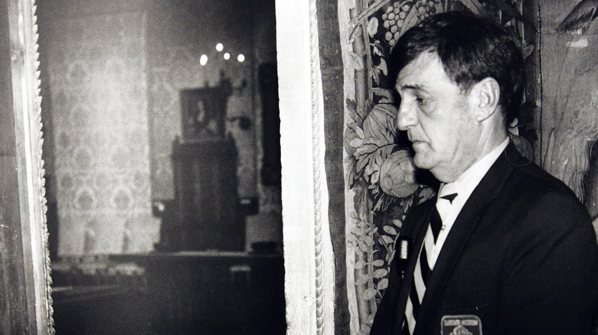 In this file photo, a security guard stands outside the Dutch Room of the Isabella Stewart Gardner Museum, the site where robbers stole treasured art objects in Boston, MA, U.S., March 21, 1990. (AP Photo)