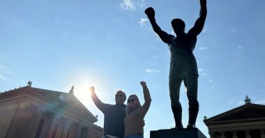 Visitors pose in front of the Rocky statue at the Philadelphia Museum of Art, Philadelphia, U.S., April 22, 2026. (AP Photo)