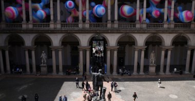People walk near the “Serotonin – The Chemistry of Happiness” installation by Sara Ricciardi for American Express, at the Pinacoteca di Brera, as part of the Milan Design Week Fuorisalone exhibition, Milan, Italy, April 22, 2026. (Reuters Photo)