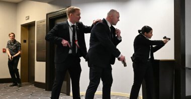 Agents draw their guns after loud bangs were heard during the White House Correspondents' dinner at the Washington Hilton, Washington, DC, U.S., April 25, 2026. (AFP Photo)
