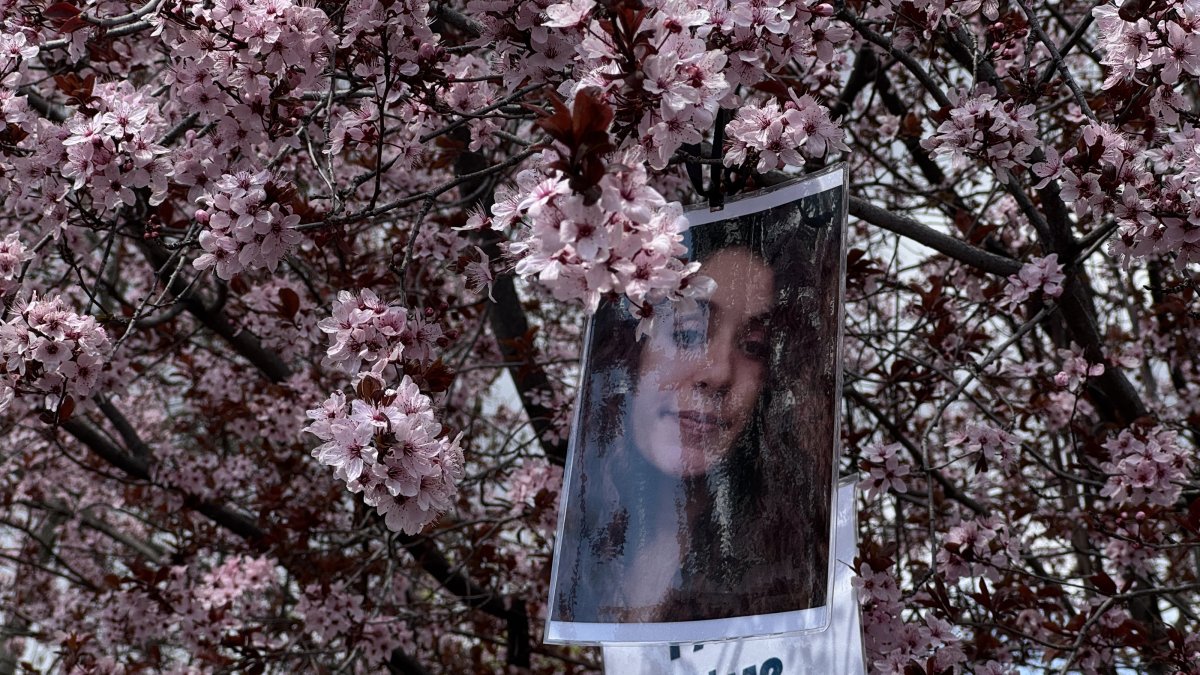 Gülistan Doku's photo hangs on tree branches during a gathering in Kışla Square, Tunceli, Türkiye, April 22, 2026. (AA Photo)