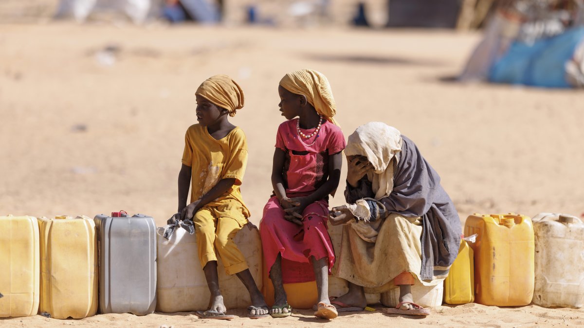 Children wait for water at a refugee camp for Sudanese war-displaced people, in Oure Cassoni, Chad, Feb. 23, 2026. (Getty Images Photo)