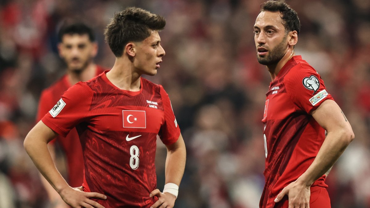 Türkiye's Arda Güler (L) and Hakan Çalhanoğlu react during a FIFA World Cup 2026 European Qualifiers match against Romania in Istanbul, Türkiye, March 26, 2026. (Getty Images Photo)