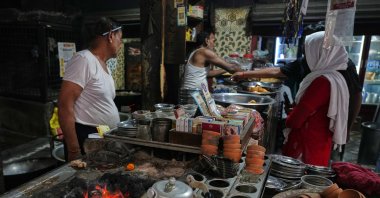 Workers cook over a coal fire at a small restaurant due to a shortage of commercial gas, Prayagraj, India, April 24, 2026. (AP Photo)
