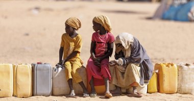 Children wait for water at a refugee camp for Sudanese war-displaced people, in Oure Cassoni, Chad, Feb. 23, 2026. (Getty Images Photo)
