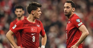 Türkiye's Arda Güler (L) and Hakan Çalhanoğlu react during a FIFA World Cup 2026 European Qualifiers match against Romania in Istanbul, Türkiye, March 26, 2026. (Getty Images Photo)