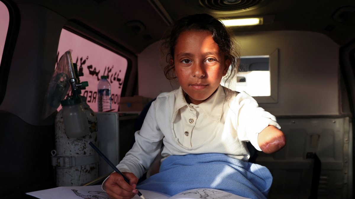A wounded Palestinian girl, evacuated from Gaza for medical treatment, arrives in an ambulance at the King Hussein Bridge, Jordan, April 27, 2026. (Reuters Photo)