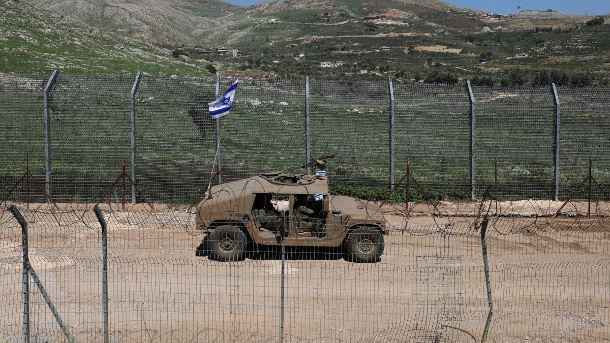 An Israeli military vehicle patrols along the security fence with Syria, near the village of Majdal Shams, in the Israeli-occupied Golan Heights, April 22, 2026. (EPA Photo)