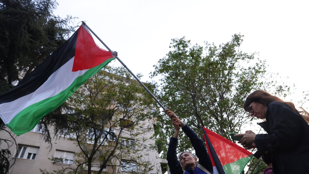 An activist waves a Palestinian flag during a protest outside the headquarters of public broadcaster RTS in Belgrade, Serbia, April 28, 2026. (EPA Photo)