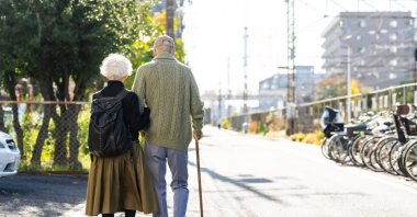 A senior couple walking together. (Shutterstock Photo)