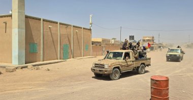 Tuareg rebels of the Azawad Liberation Front (FLA) coalition ride on the back of a pickup truck in Kidal, Mali, April 26, 2026. (AFP Photo)