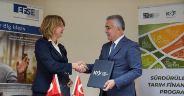 KGF Board Chairperson Erdoğan Özegen and EFSE Portfolio Manager Jasminka Begert shake hands after signing the protocol, Ankara, Türkiye, April 28, 2026. (AA Photo)