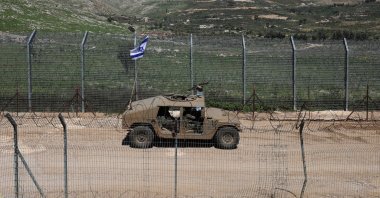 An Israeli military vehicle patrols along the security fence with Syria, near the village of Majdal Shams, in the Israeli-occupied Golan Heights, April 22, 2026. (EPA Photo)