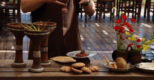 Master chef and culinary researcher Ömür Akkor offers members of the press a tasting of a menu he created by adapting the eating habits of people living in Mesopotamia 12,000 years ago, Şanlıurfa, Türkiye, April 27, 2026. (AA Photo)