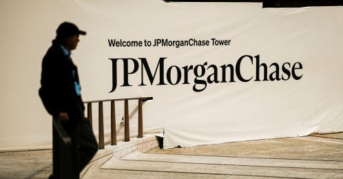 A person waits near one of the entrances of the JPMorgan Chase and Co. headquarters, New York City, U.S., April 1, 2026. (Reuters Photo)