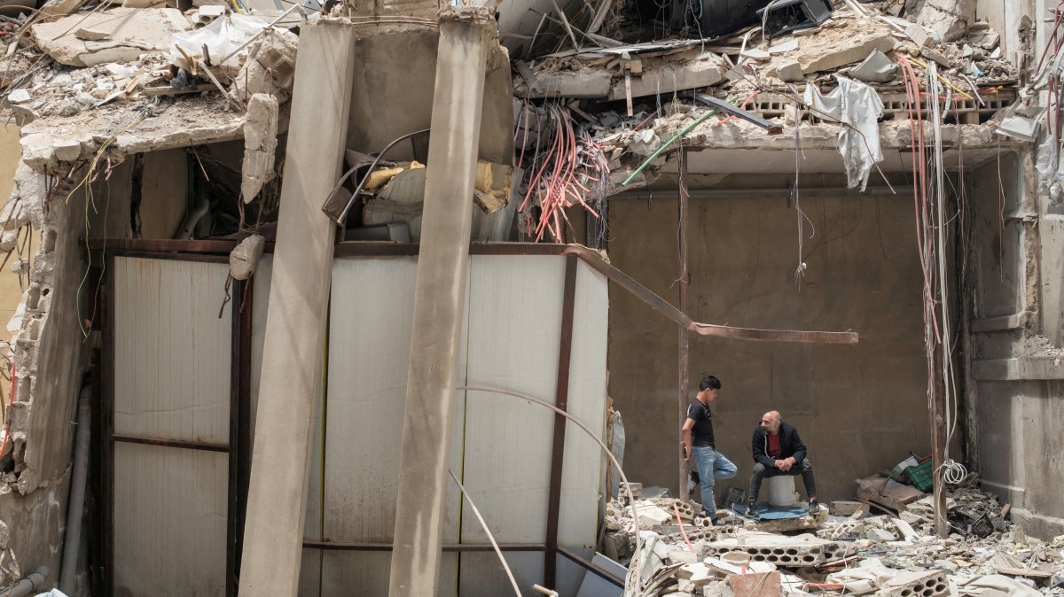 People shelter inside a destroyed building, amid a temporary cease-fire between Lebanon and Israel, Tyre, southern Lebanon, April 28, 2026. (Reuters Photo)