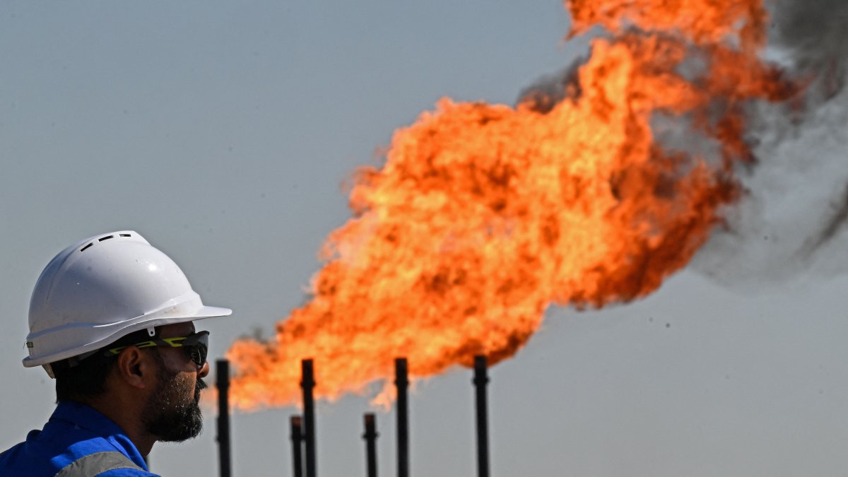 An employee of Basra Oil Company, inspects the Nahr Bin Umar Oil and Gas Field on the outskirts of the southern city of Basra, Iraq, April 29, 2026. (AFP Photo)