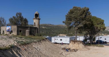 Illegal Jewish settler houses overlook a mosque at the Sa-Nur settlement south of Jenin in the Israeli-occupied West Bank, Palestine, April 28, 2026. (AFP Photo)