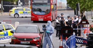 A forensic officer and police officers at the scene where two Jewish men are seriously injured after being stabbed in Golders Green, north London, Britain, April 29, 2026. (EPA Photo)